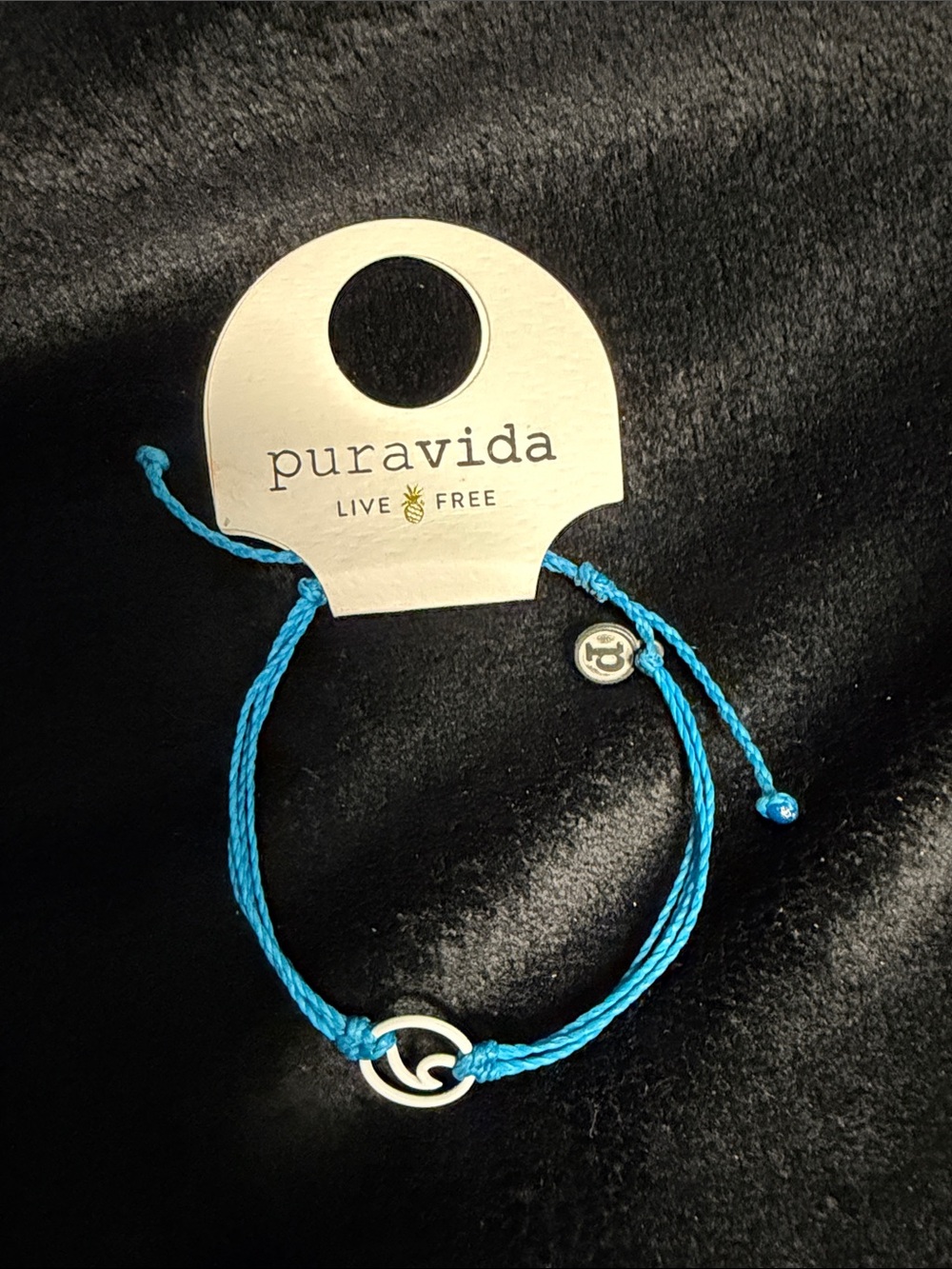 PURA VIDA ENAMEL WAVE WHITE CHARM & LOGO ON A TURQUOISE 4 STRAND WAXED BRACELET